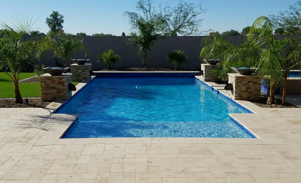 Sunlit custom swimming pool built by Saturn Pools in the Phoenix valley